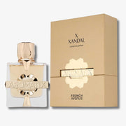 A bottle of Aromatix X Xandal French Avenue perfume next to its gold-colored packaging box, set against a clean white background.