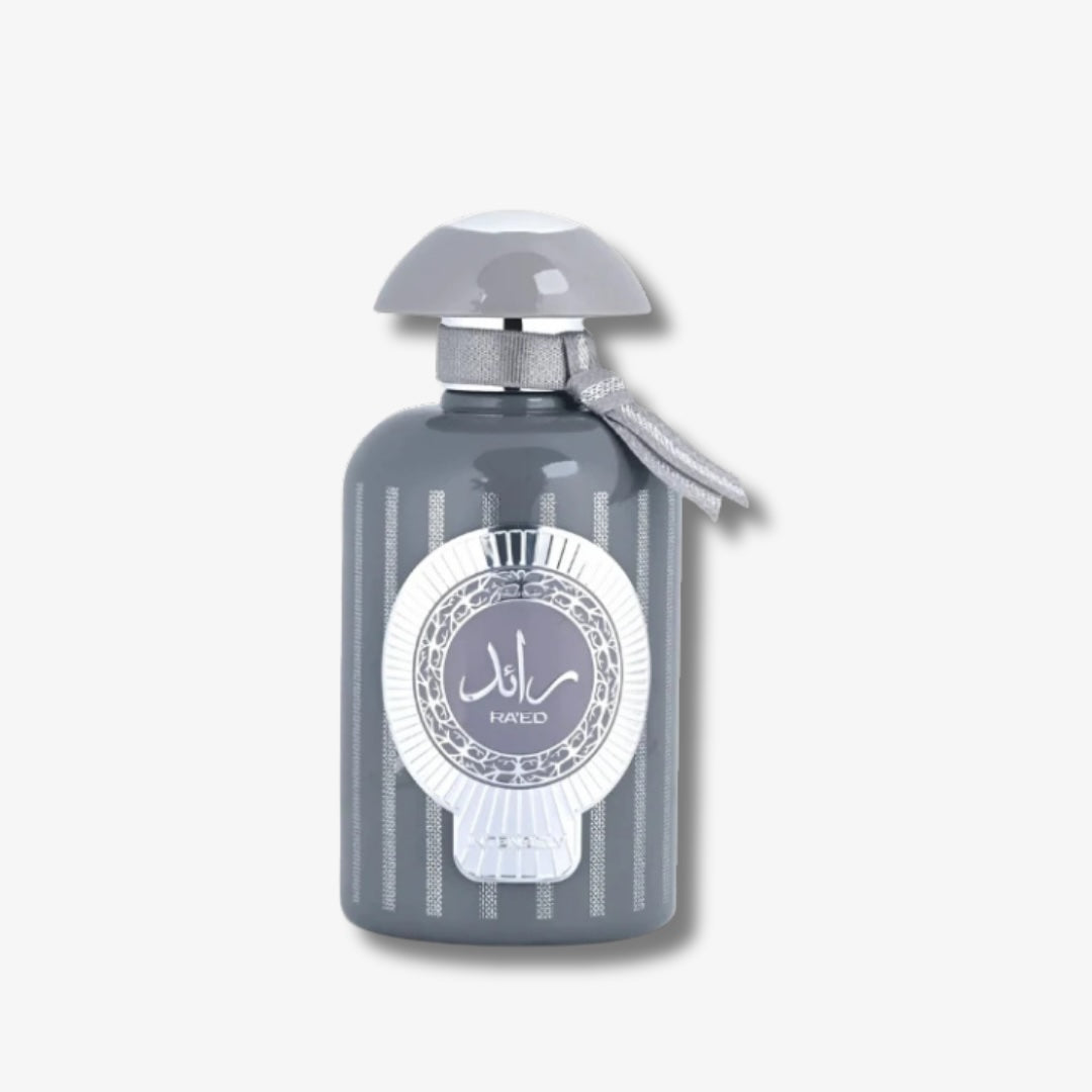 Gray perfume bottle with decorative label on a light gray background