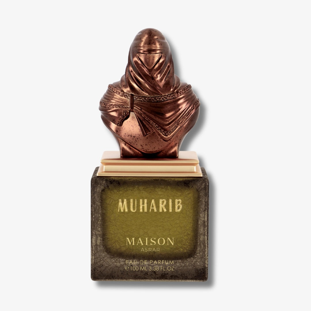 Perfume bottle with bronze figure on top labeled 'Muharib' by Maison Aram