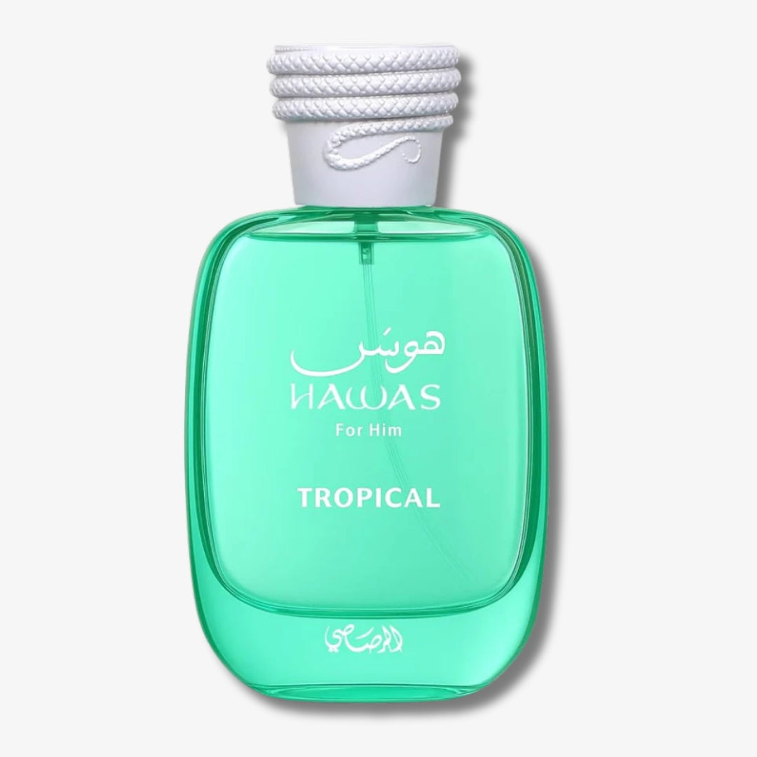 A bottle of HAWAS For Him Tropical cologne, featuring a translucent mint green glass bottle with a white rope-wrapped cap, set against a light gray background.
