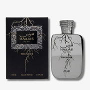 A bottle of Hawas For Him Thunder Eau De Parfum next to its black packaging box, both featuring silver and gold lightning bolt graphics.