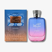 A bottle of Hawas For Her London Eau De Toilette next to its blue and pink packaging box, featuring a blue-to-pink gradient bottle with a silver cap on a light gray background.