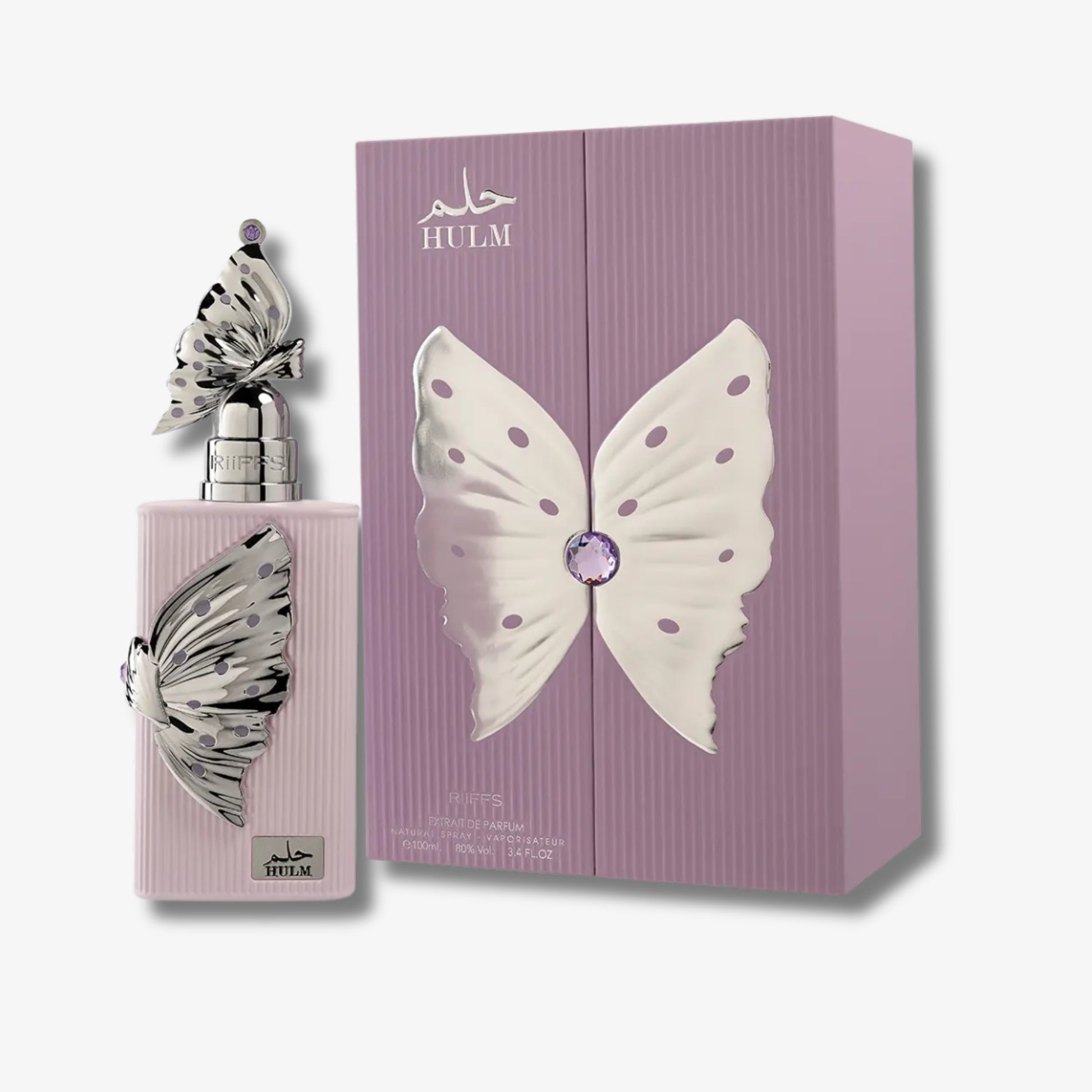 Hulm Halm perfume bottle and matching box, both decorated with a large white butterfly motif and a silver-toned butterfly accent, on a light gray background.