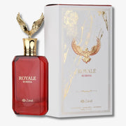 A bottle of Zakat Royale Rubinia perfume next to its white and gold packaging box, featuring a golden eagle design.