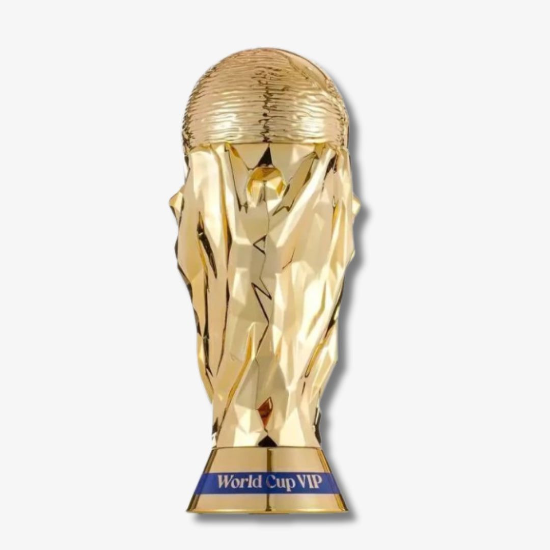 Gold World Cup trophy on a white background